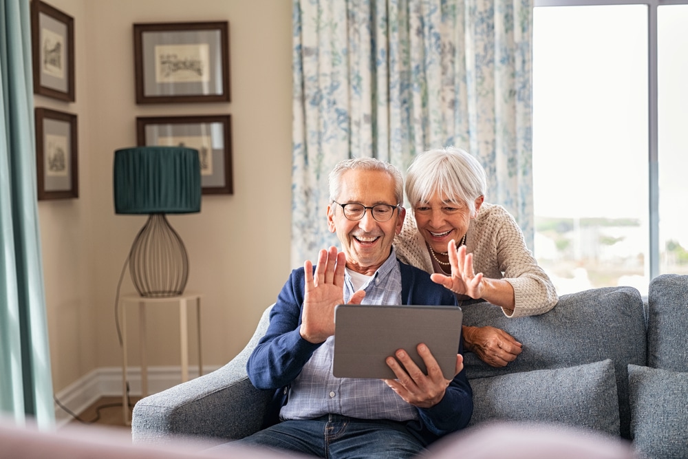 Senior couple using technology to stay in touch at Concord assisted senior living