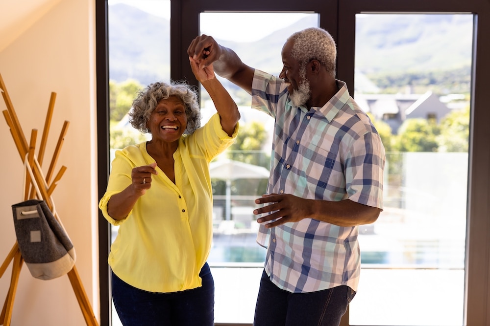 A senior couple dances together at a class offered by Concord memory care services